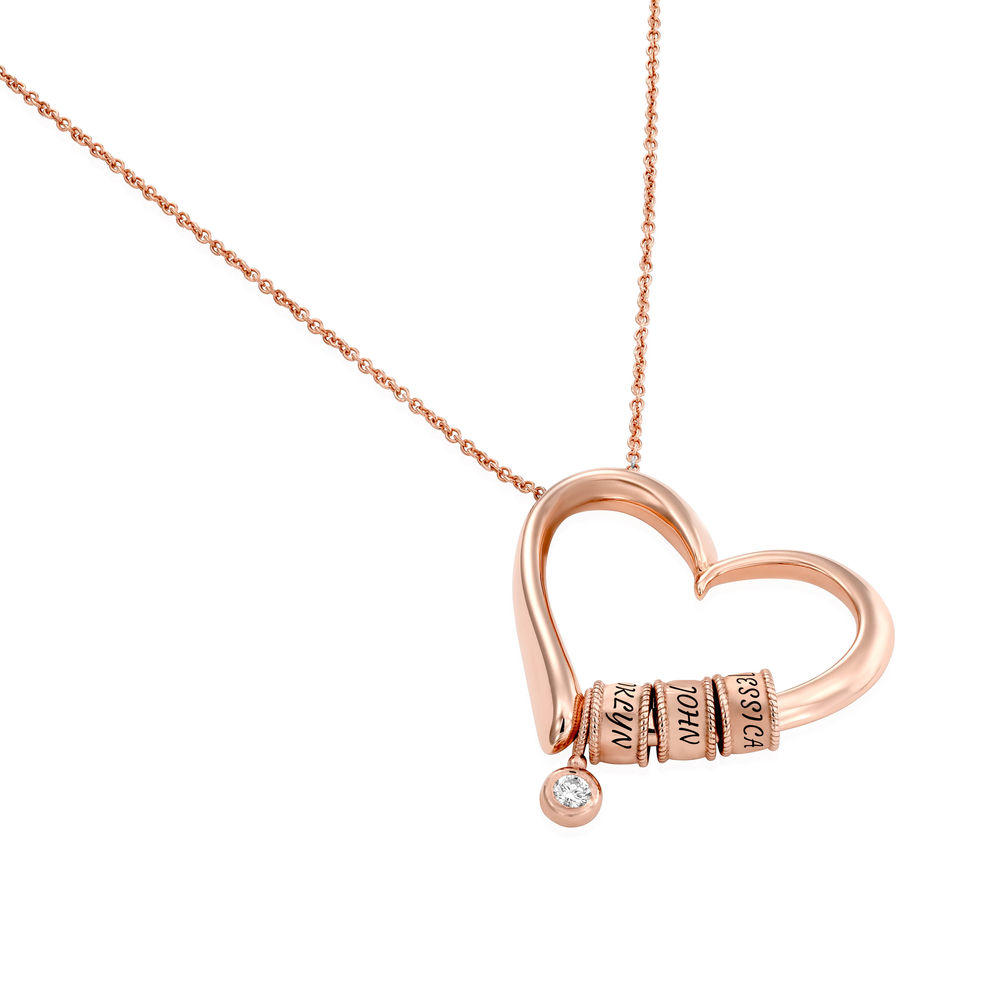 Charmevolle Herz-Halskette mit eingravierten Perlen und Diamant in Roségold - 1 Produktfoto