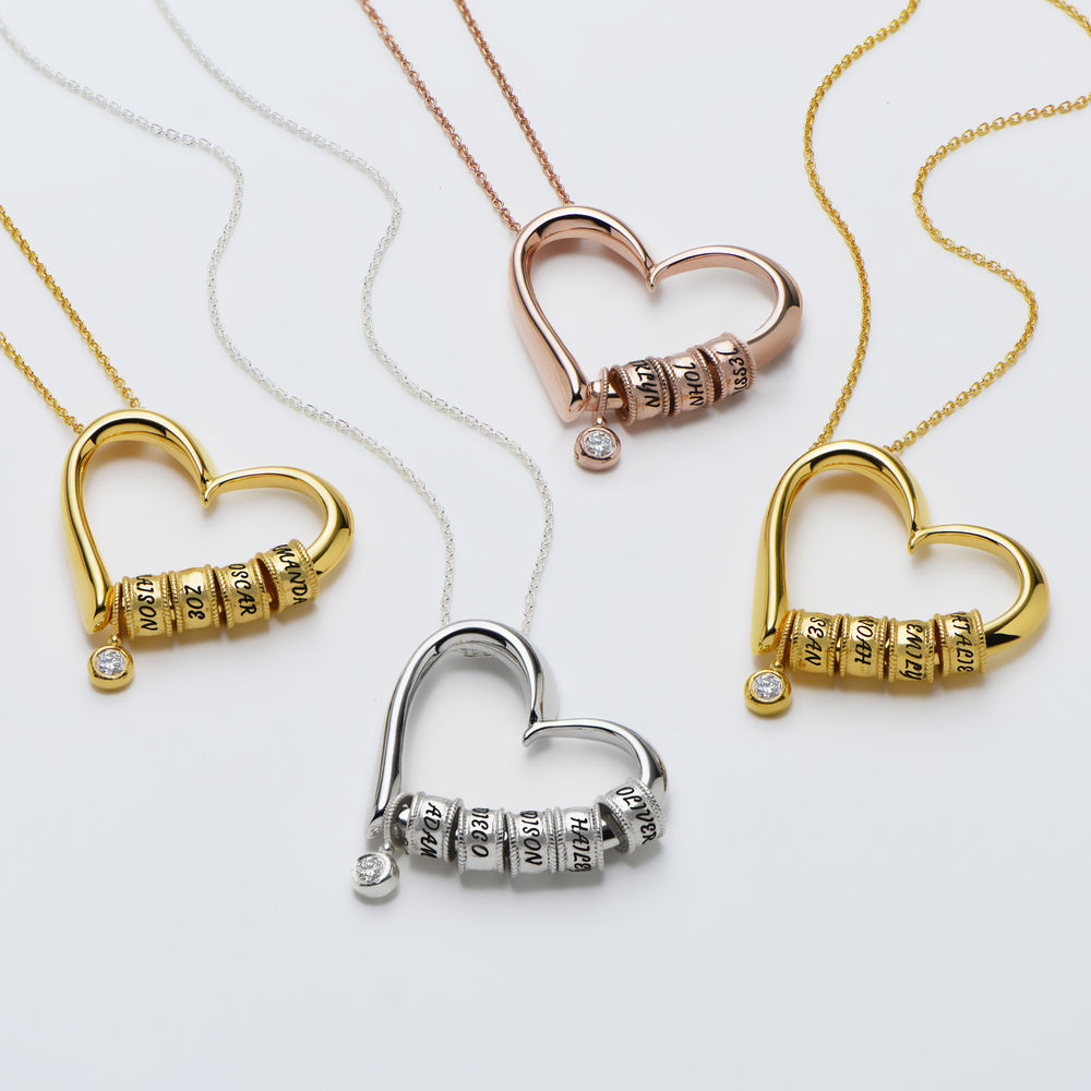 Charmevolle Herz-Halskette mit eingravierten Perlen und Diamant in Roségold - 2 Produktfoto