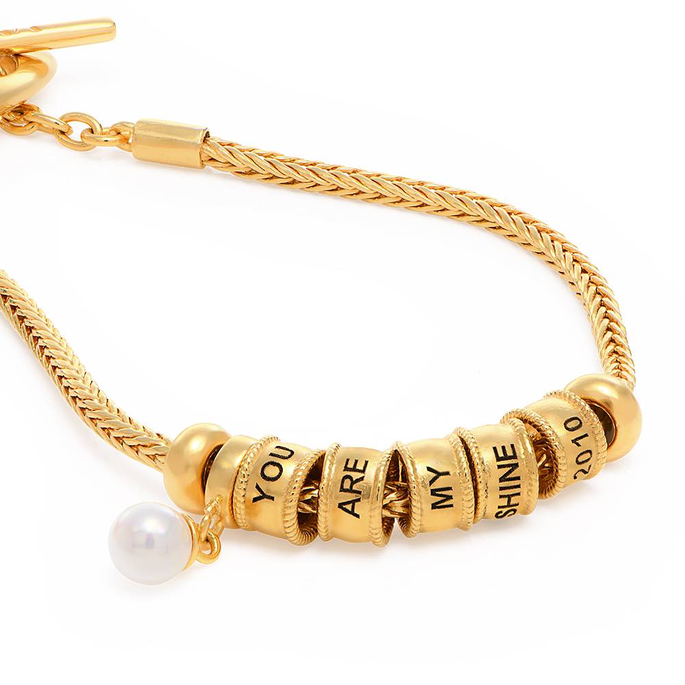 Linda Charm-Armband mit Perle und Herzverschluss - 750er vergoldetes Produktfoto
