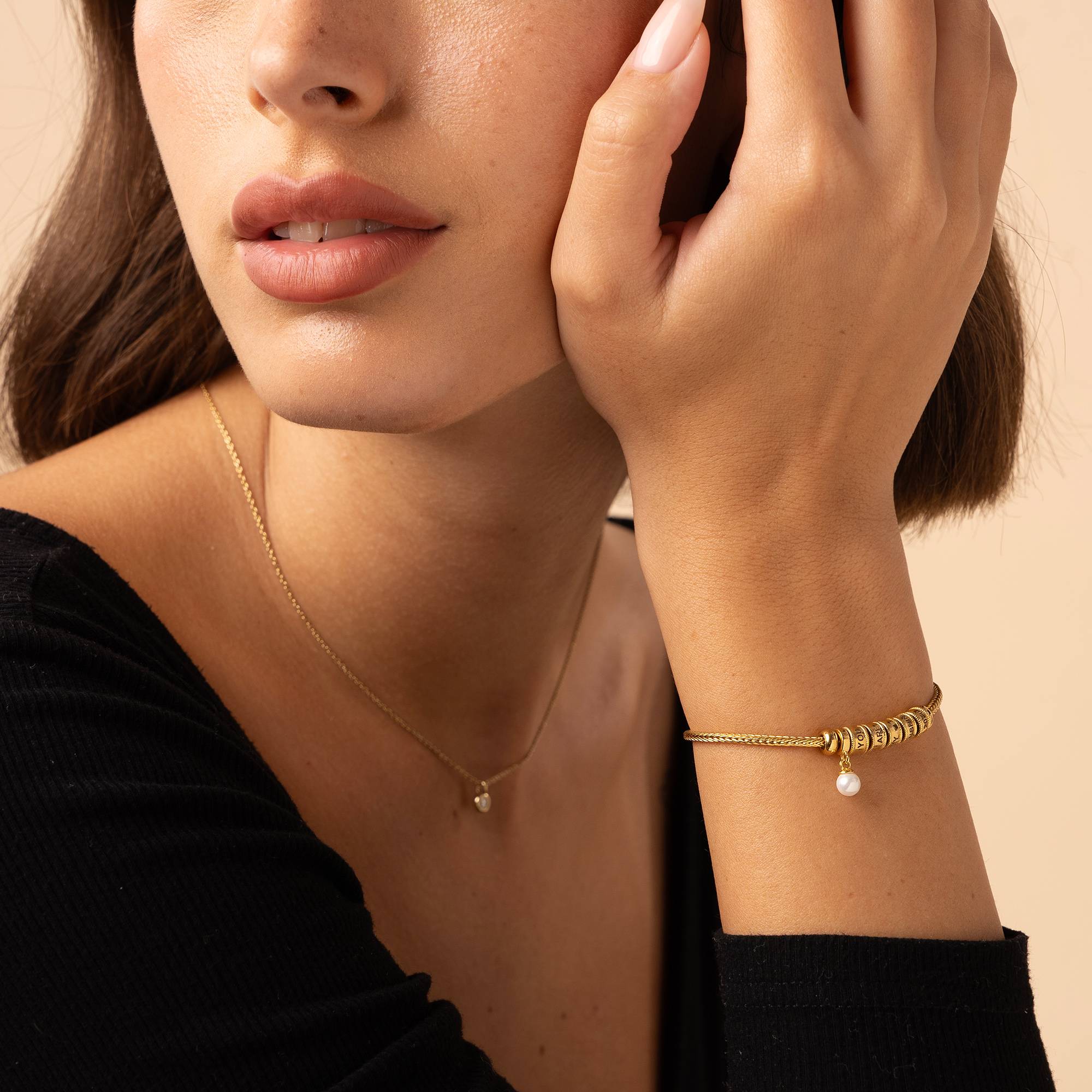 Linda Charm-Armband mit Perle und Herzverschluss - 750er vergoldetes Silber-4 Produktfoto