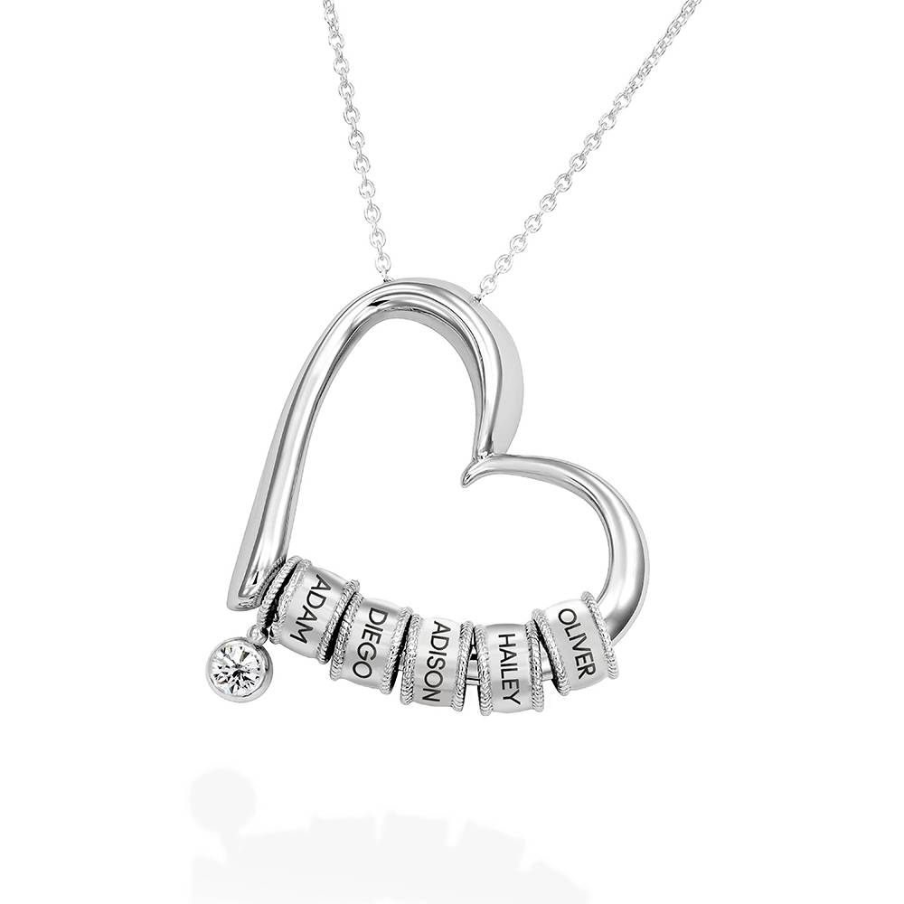 Charmerende hjertehalskæde med graverede charms i sølv og diamant produkt billede