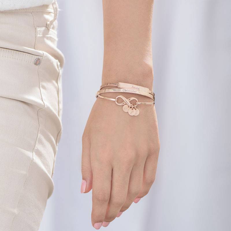 Infinity Bangle Bracelet with Initial Charms in Rose Gold Plating-3 product photo