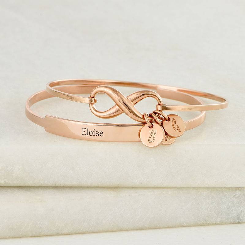 Infinity Bangle Bracelet with Initial Charms in Rose Gold Plating product photo