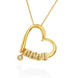 Charmerende hjertehalskæde med indgraverede charms i guld Vermeil og produkt billede