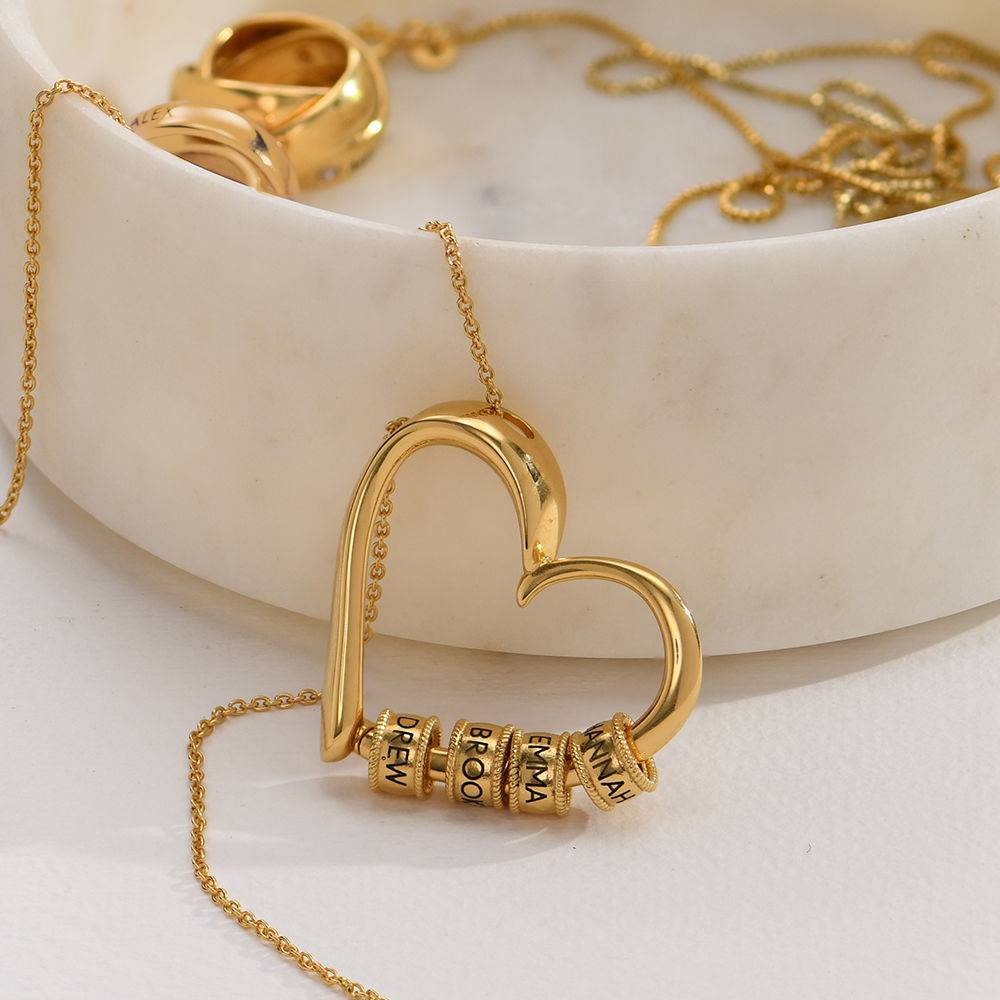 Charming Heart hjertehalskjede med graverte charms i gull vermeil
