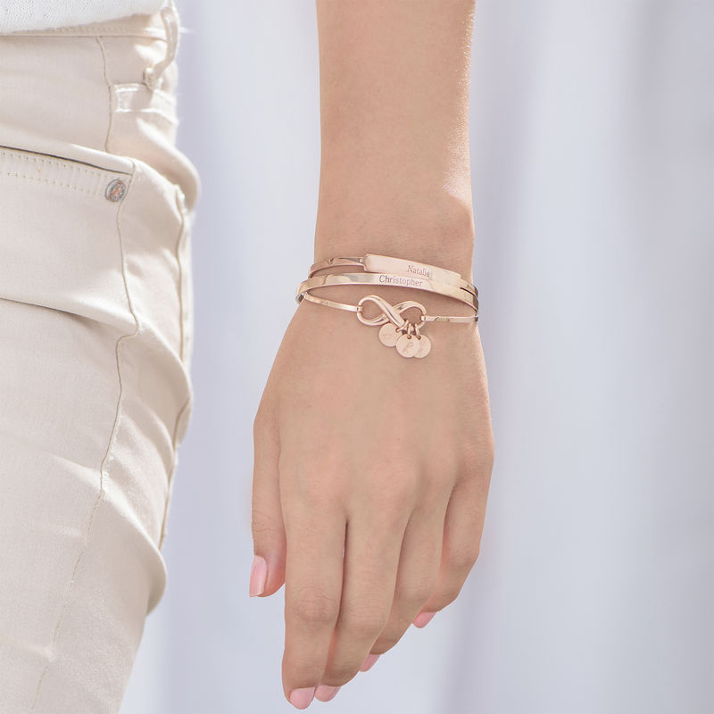 Infinity Bangle Bracelet with Initial Charms in Rose Gold Plating - 3 product photo